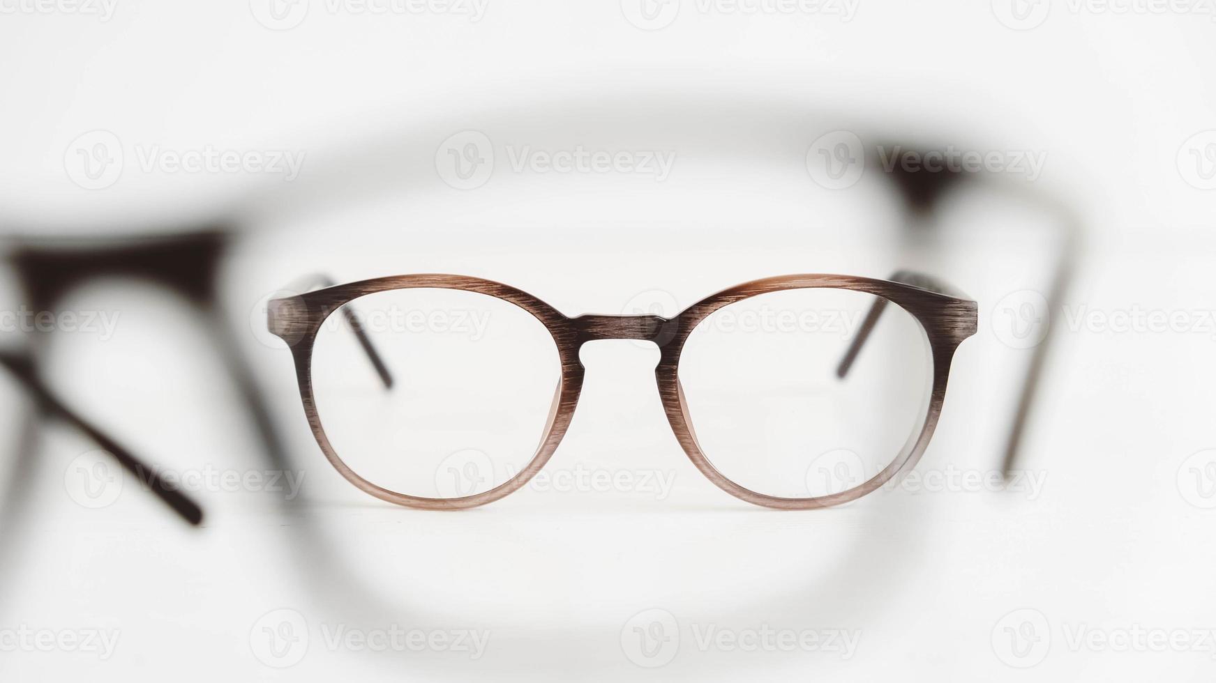 Optical glasses of different shapes on a white background photo