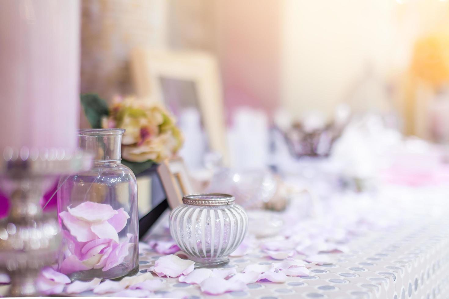 Beautiful vanity with purple flower petals and perfume bottles.dressing on teble for makeup.shallow focus effect. photo