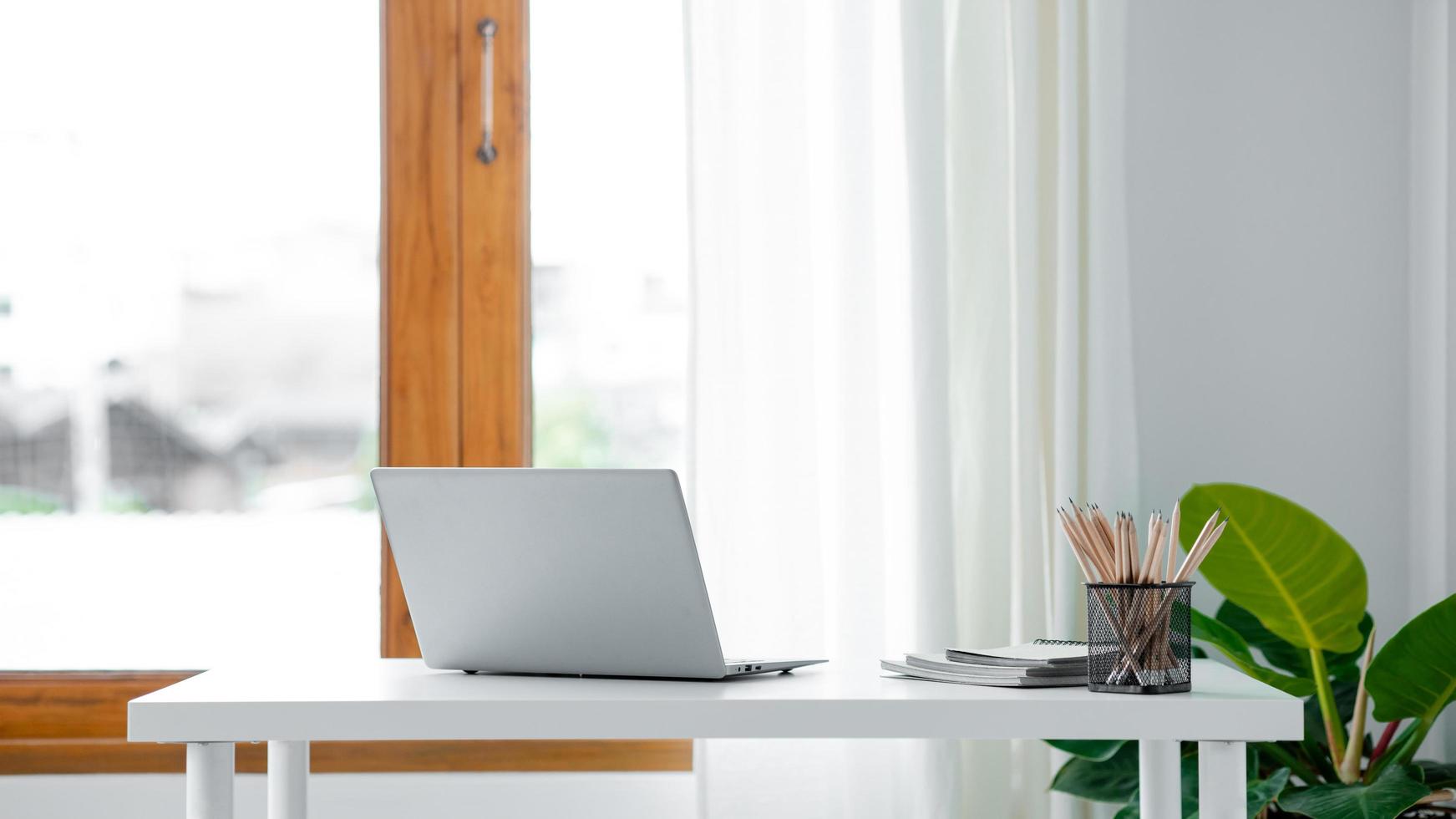 Startup company desks, empty offices, office spaces in marketing staff's offices, desks with office equipment for work, window desks, Meeting rooms in startup companies. Office desk placement ideas. photo