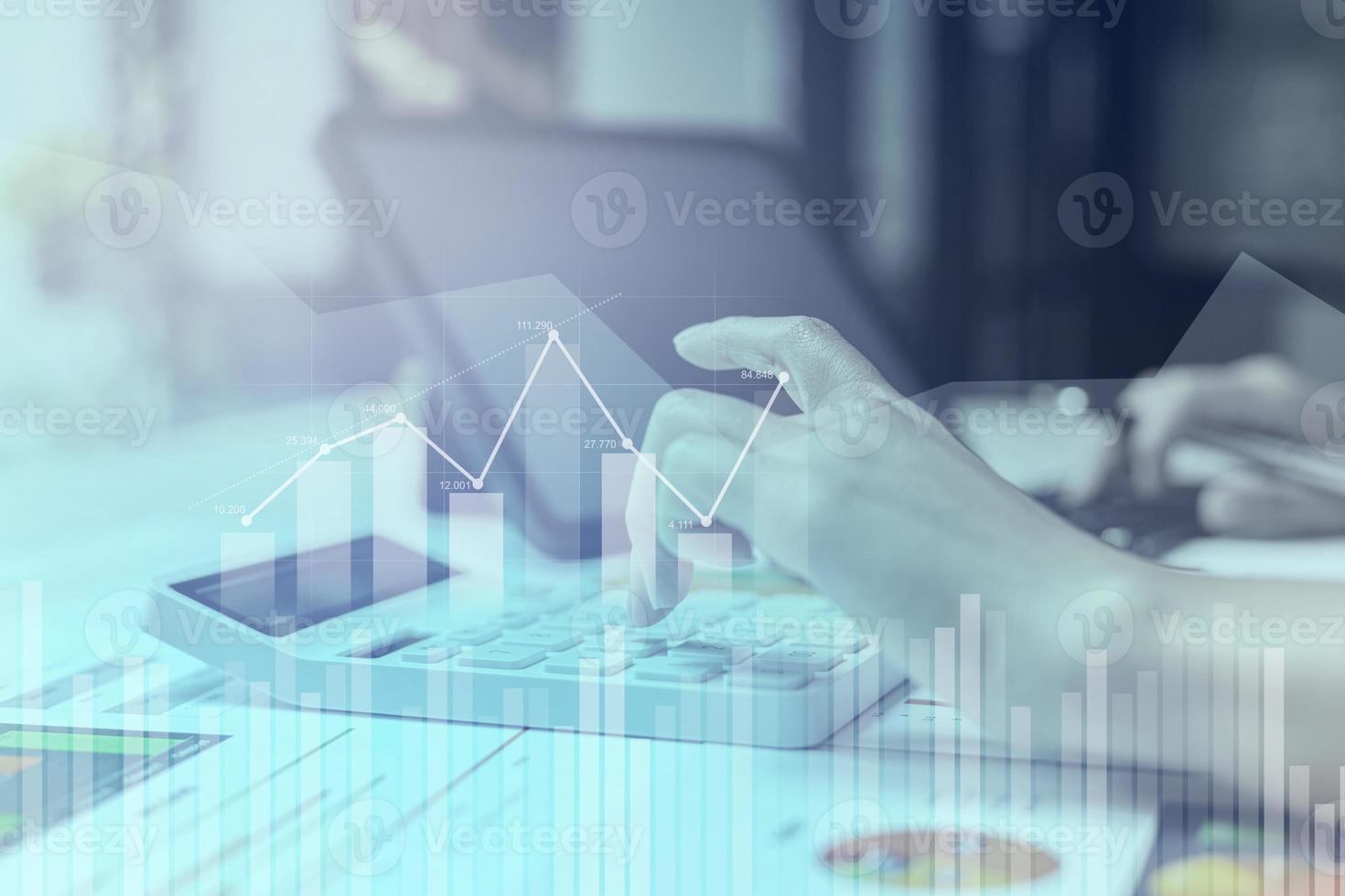 Businesswoman presses a calculator to check data on documents, company financial reports, graphics showing financial and numerical growth data. Financial management to grow and be a profitable concept photo