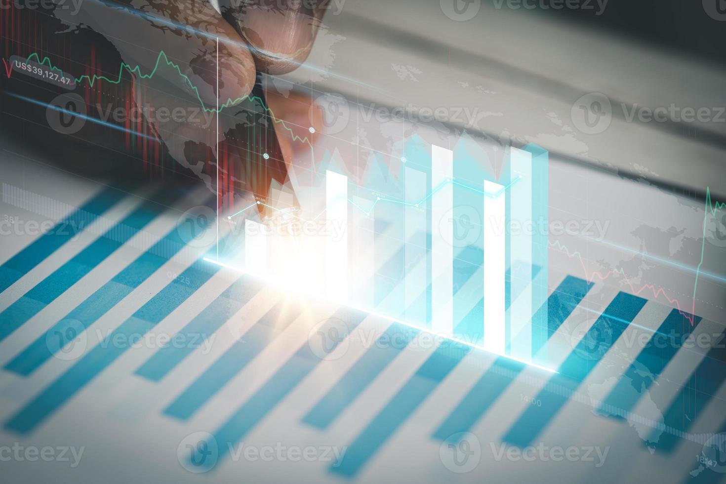 A business man examines data on financial documents, company financial reports, graphics showing financial and numerical growth data. The concept of financial management to grow and be profitable. photo