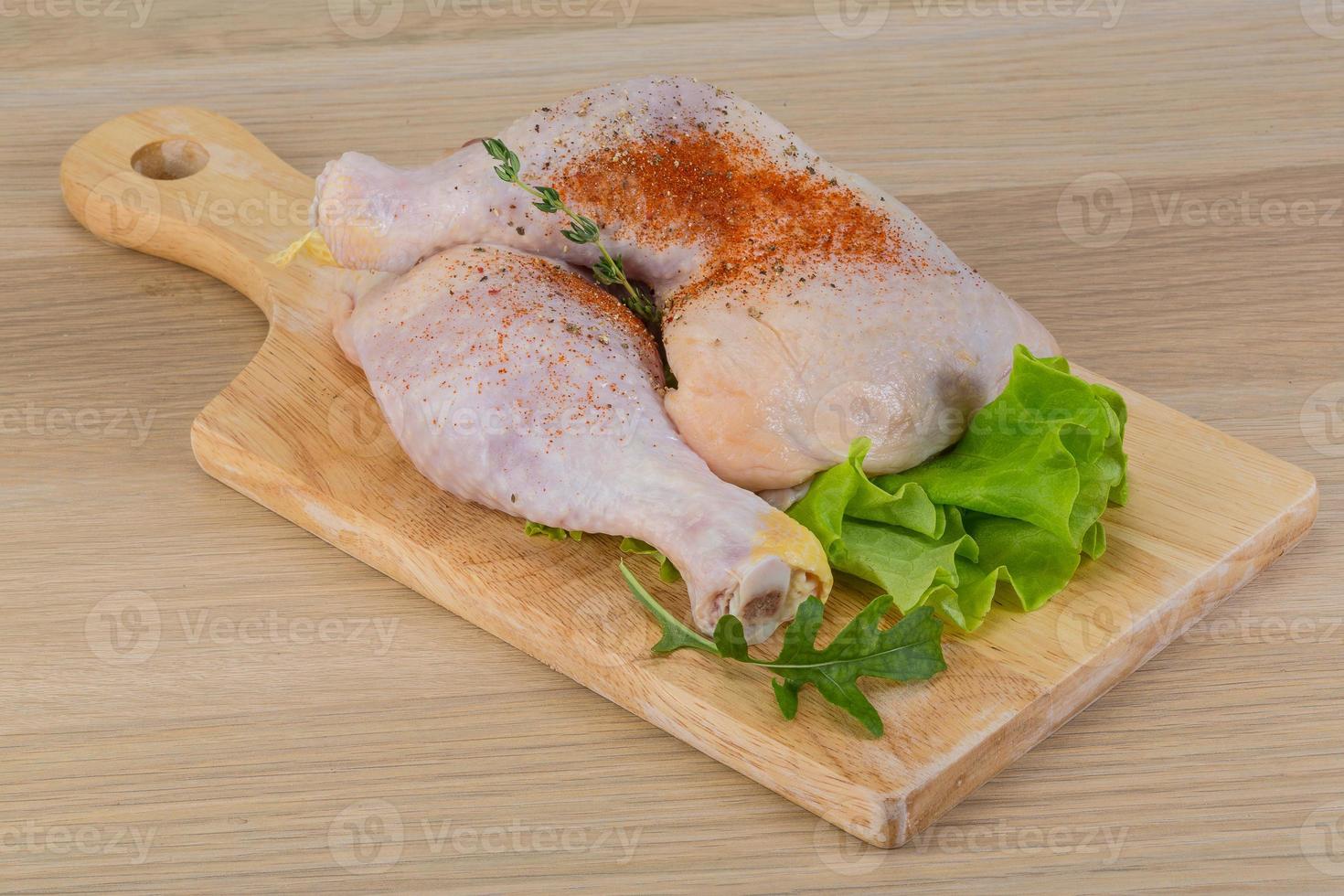 Raw chicken leg photo