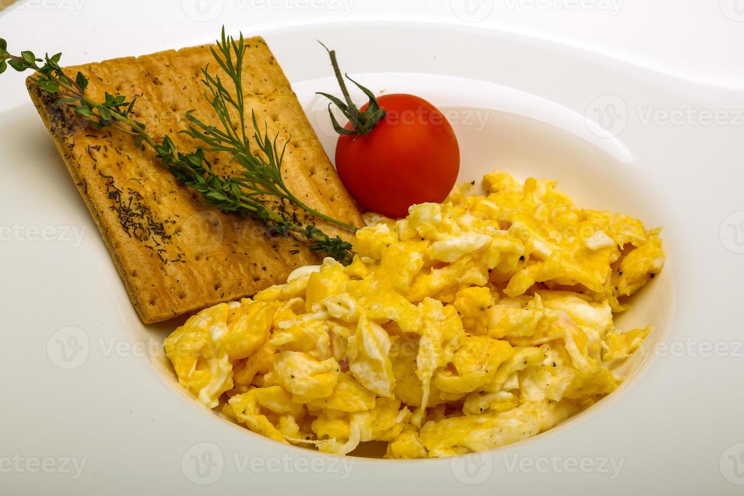 Scrambled eggs with tomato photo