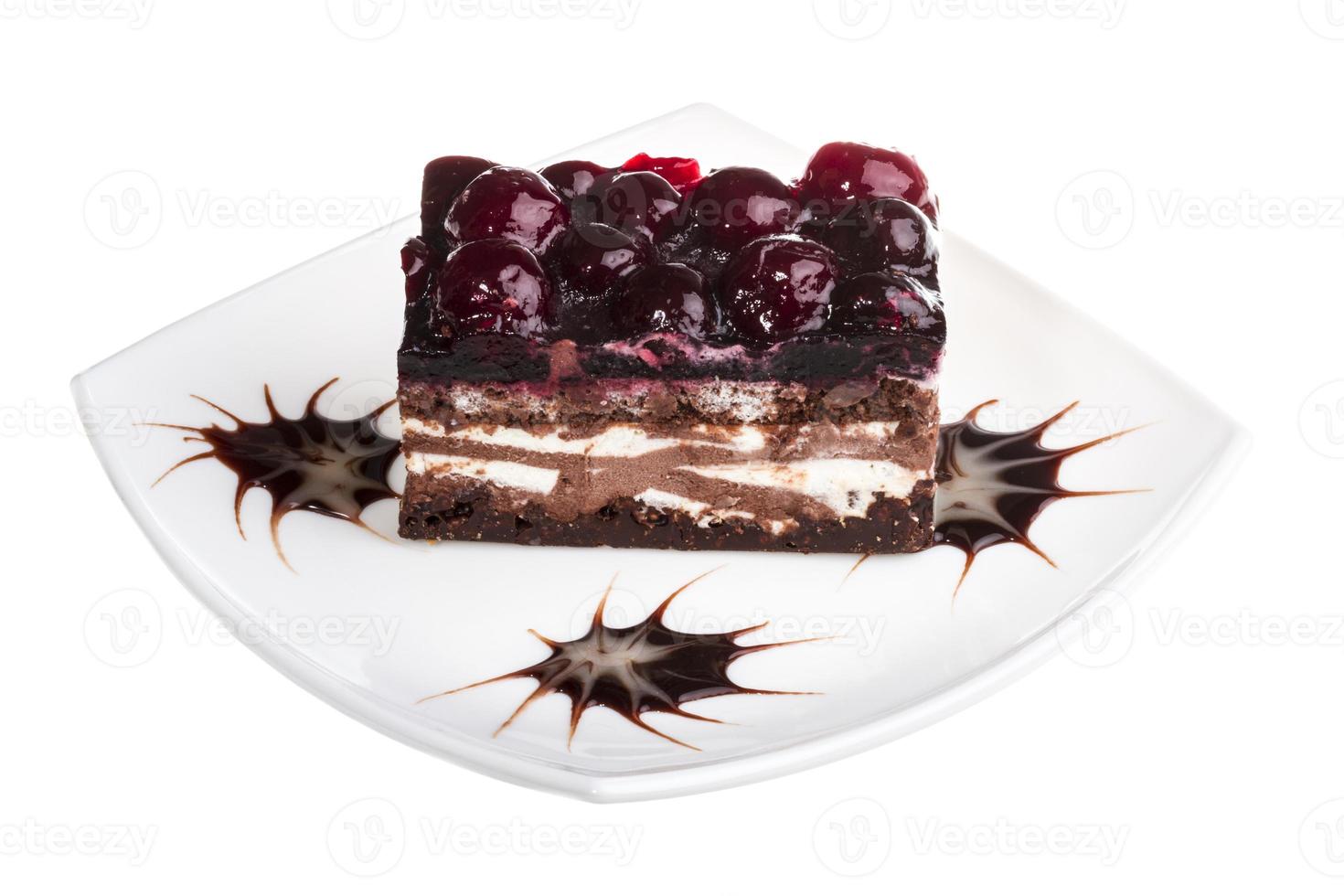 Chocolate cake with cherry on top on a white background photo