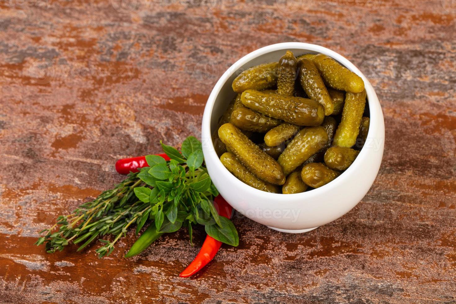 Pickled small cucumbers photo