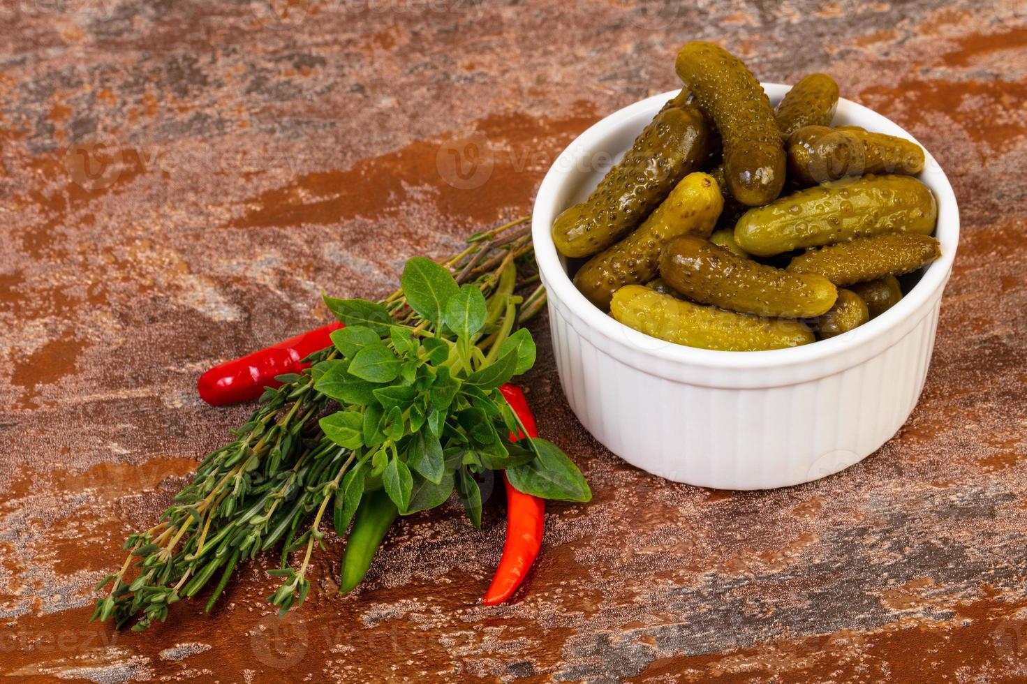 Pickled small cucumbers photo