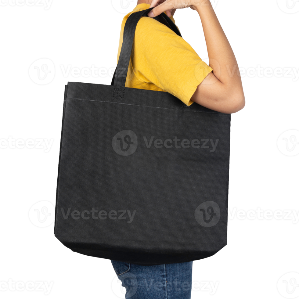 Woman holding blank black fabric canvas bag mockup png