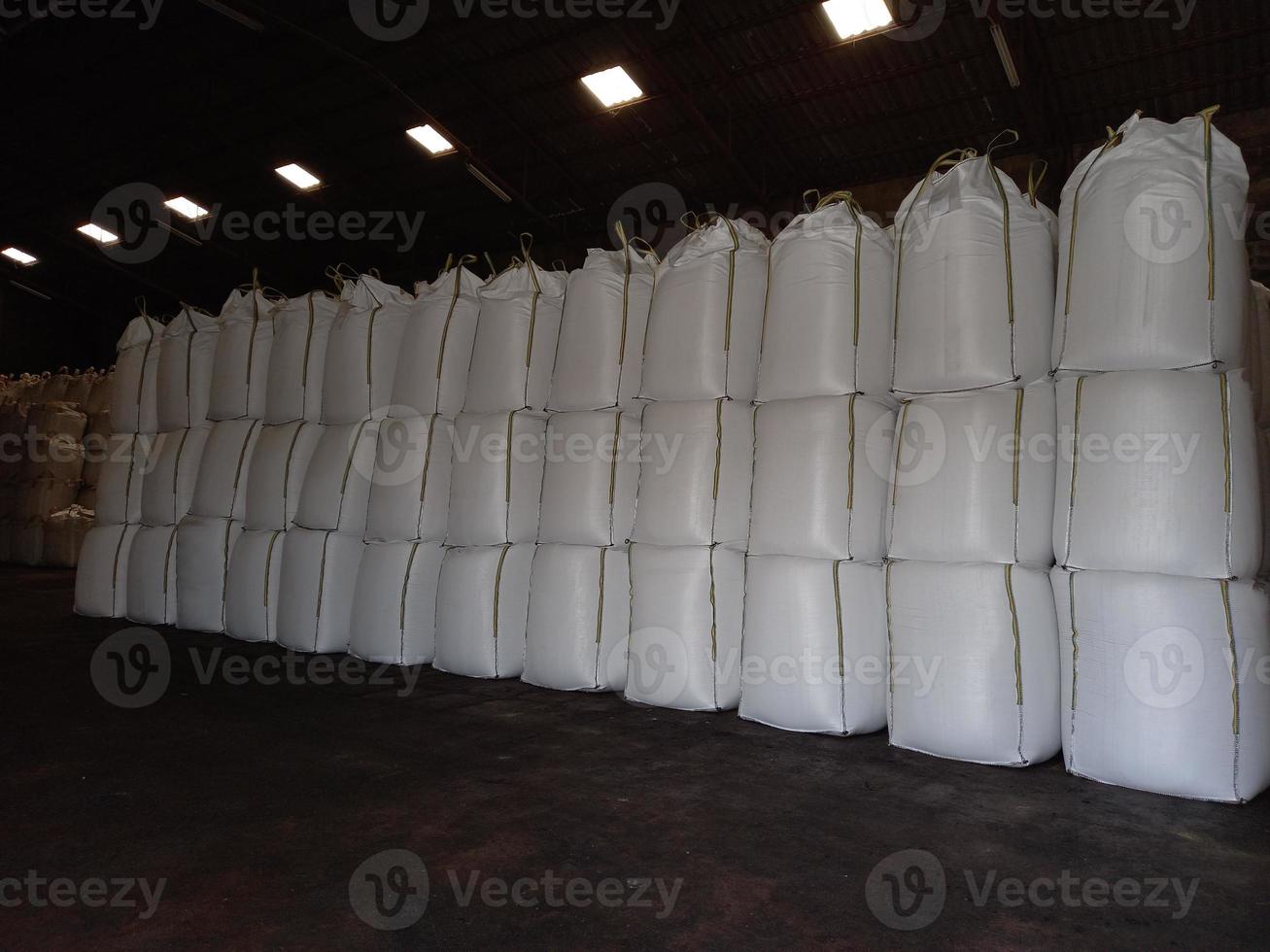 Large jumbo hemp sack White, packed with chemical fertilizer, rice, sugar, placed  waiting to be delivered to the customer photo