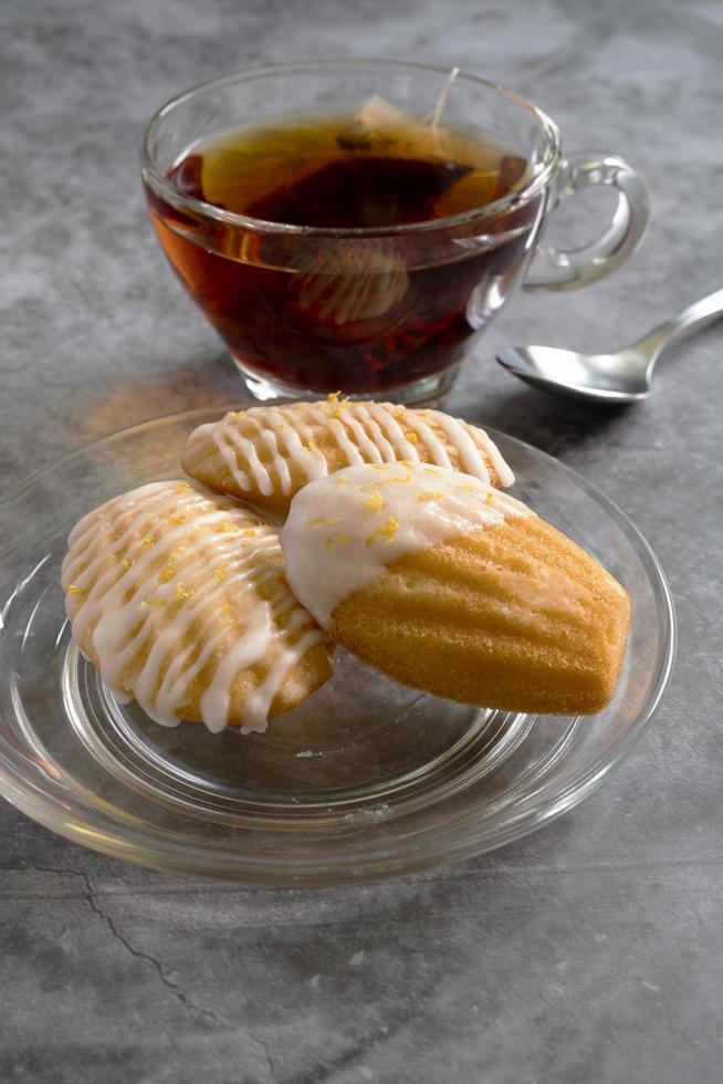 French Madeleine Egg Pastry with Hot Tea photo