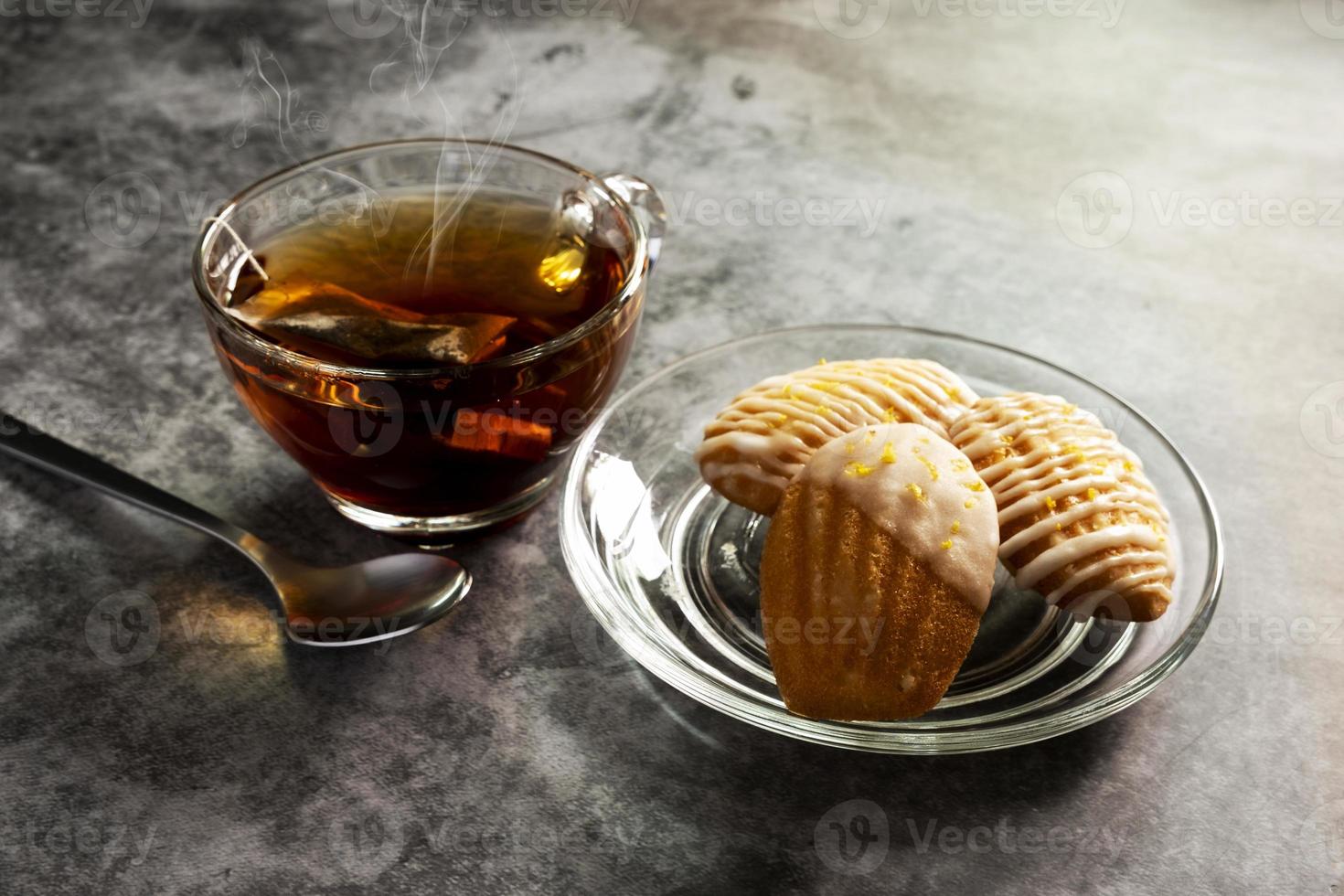 French Madeleine Egg Pastry with Hot Tea photo