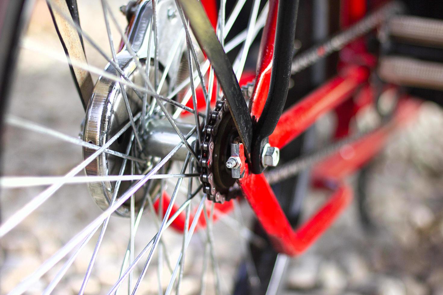 Bicycle detail view of rear wheel with bicycle chain. photo