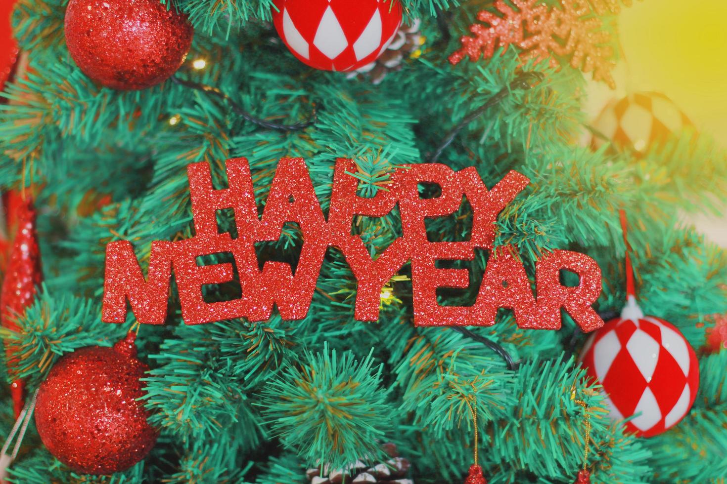 Happy New Year on pine background. photo