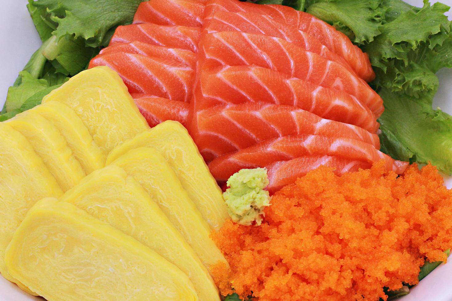 Sushi set raw salmon sashimi,Tobiko egg with vegetables,Healthy concept. photo