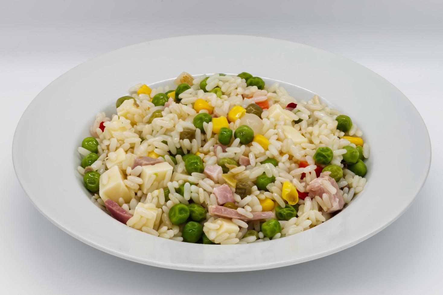 Italian Cold Rice Salad, Riso Freddo. Fresh and healthy summer salad on white background. photo