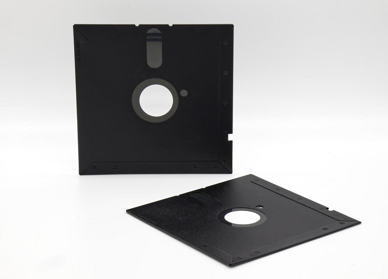 Vintage Floppy Disk 5.25 inch. Retro storage technology on white background. photo