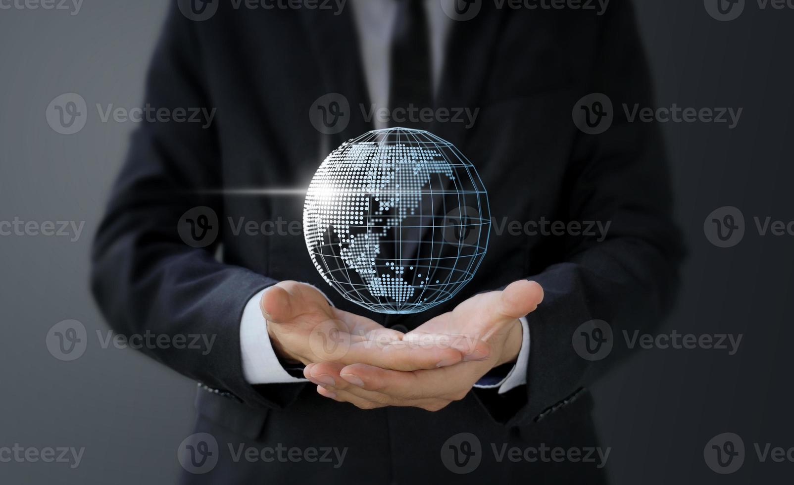 Businessman holding digital world map in hand photo