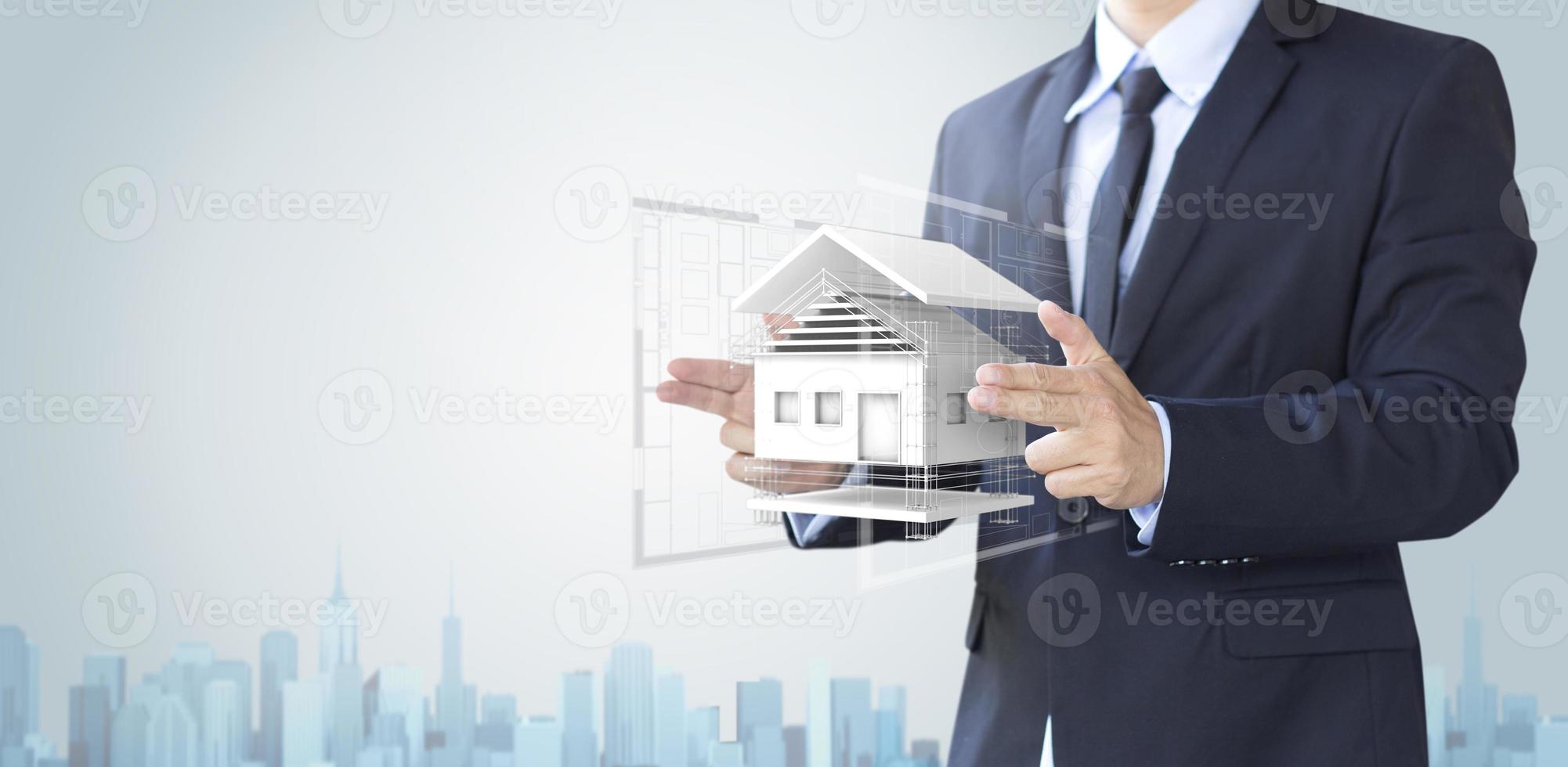 Businessman create design house or home, architecture concept photo