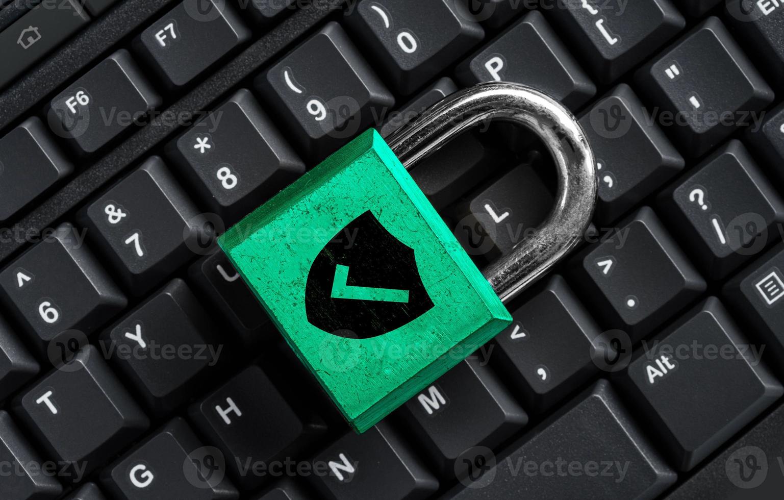 Master key on black keyboard, computer security privacy photo