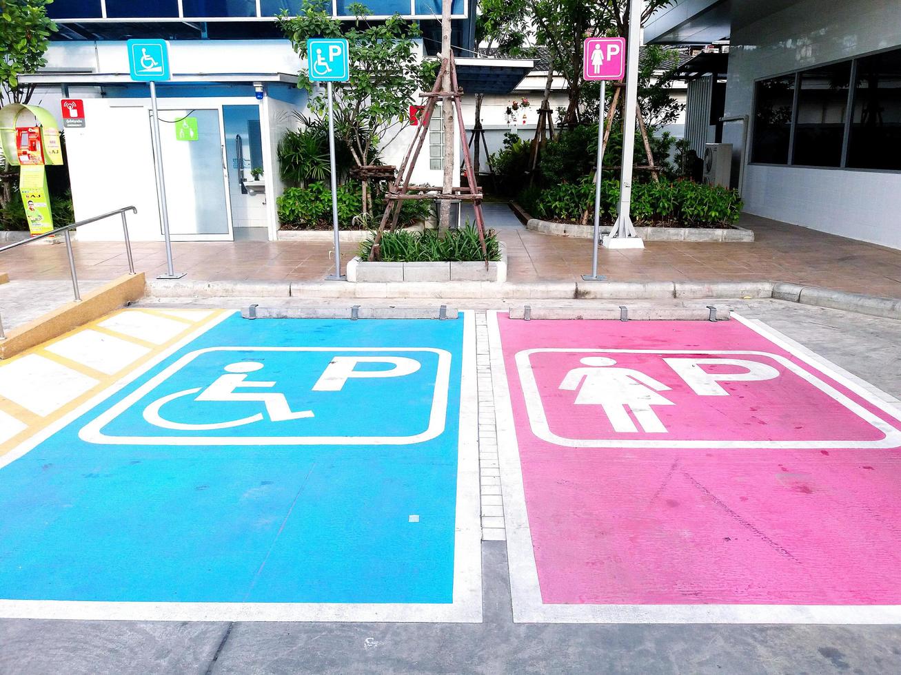Bangkok, Thailand - August 27, 2016 Sign parking car. The space area reserved for the disabled people parking and lady parking in front of the public toilet and disabled toilet photo