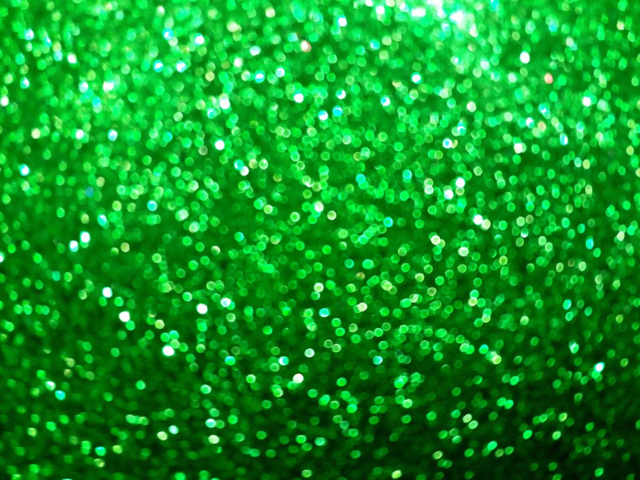 Glitter light. Small Green and white bokeh light abstract background. photo