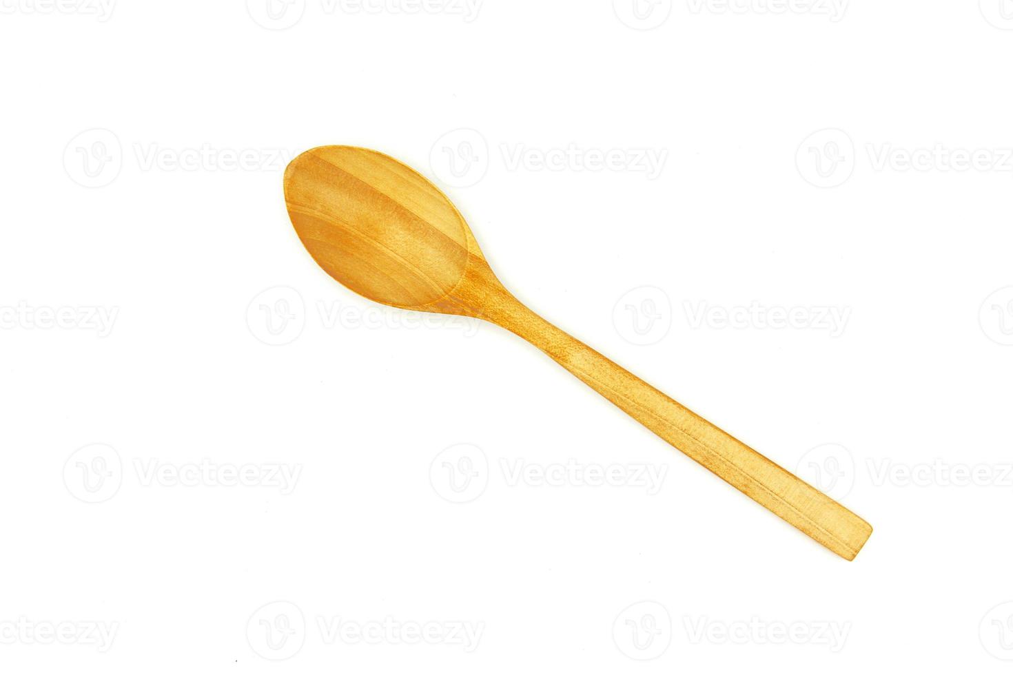 Close up and top view wooden spoon on isolated white background. Studio light concept photo