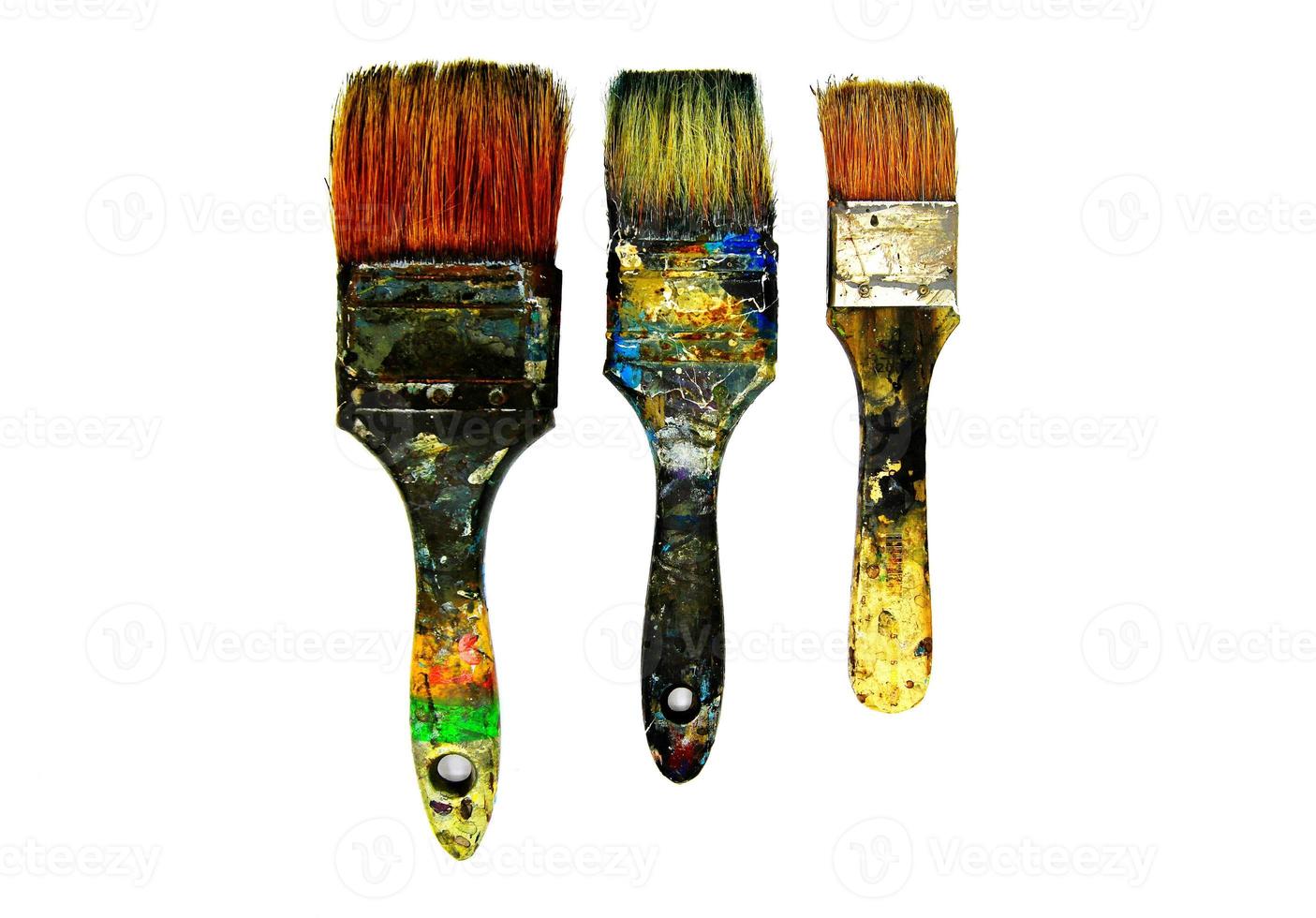 Three dirty paintbrushes be stained color isolated on white background. Artist's paintbrush photo