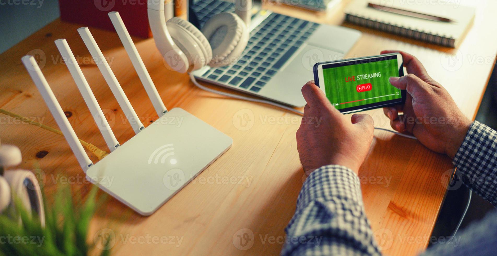 Young man Connecting router wifi On smartphone  for Internet and online Live streaming photo