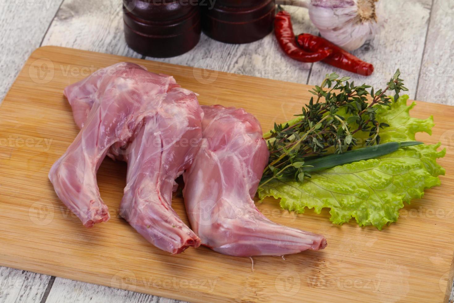 Raw rabbit legs photo