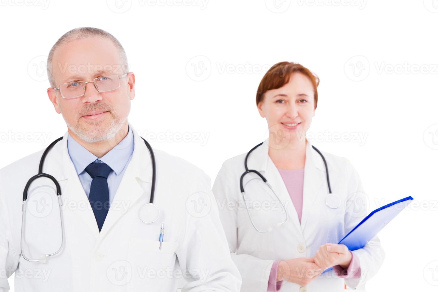 portrait two smile doctors isolated on white background, medical insurance, focus on male doctor photo