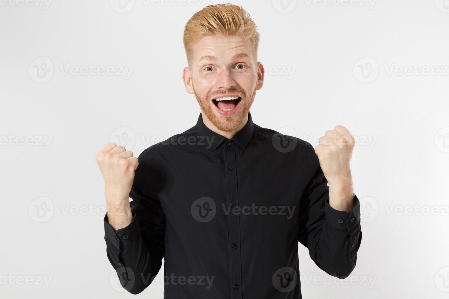 Lucky Red hair Man over isolated white background photo