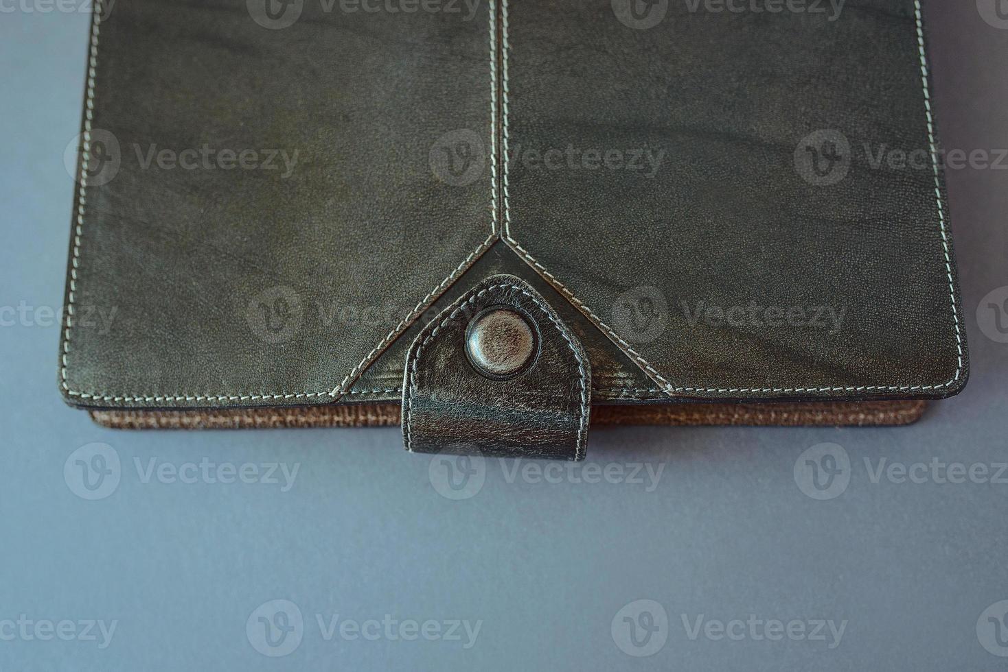 leather notebook on grey background photo