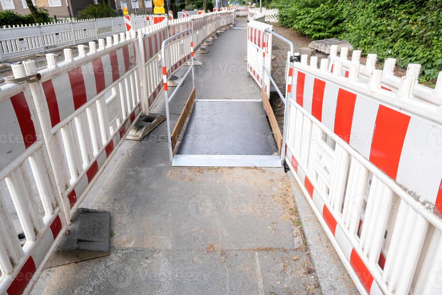 Construction site barrier of a road with a sidewalk photo