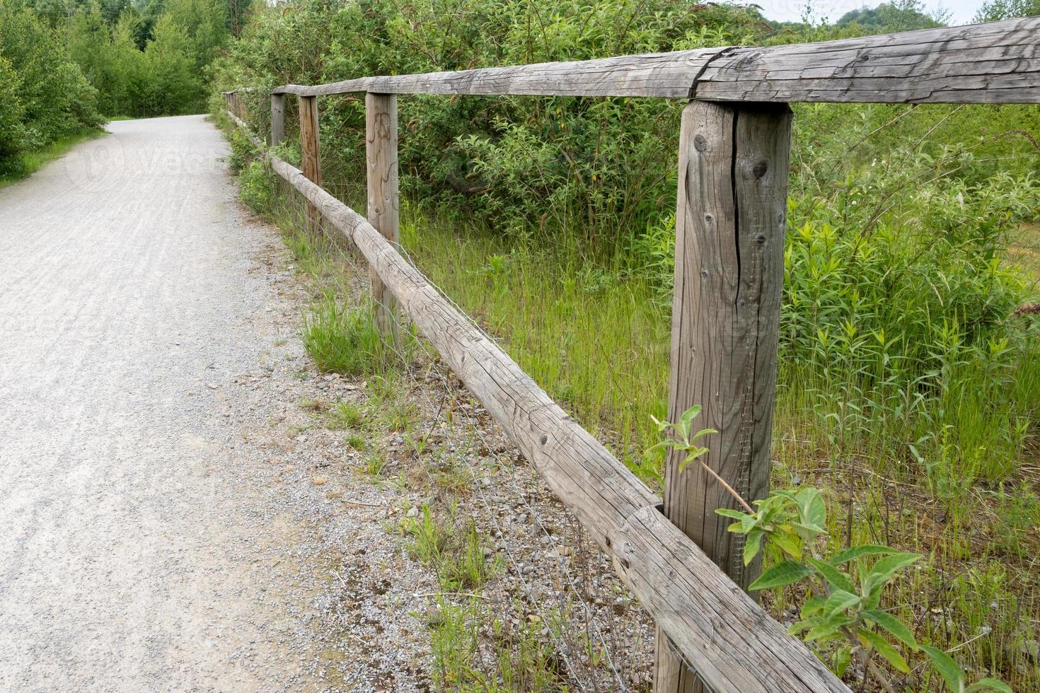 wooden fence with little road photo