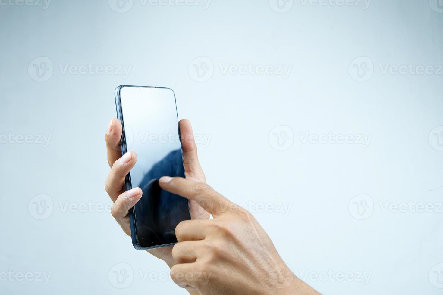 Men touching phone screen isolated on white background photo