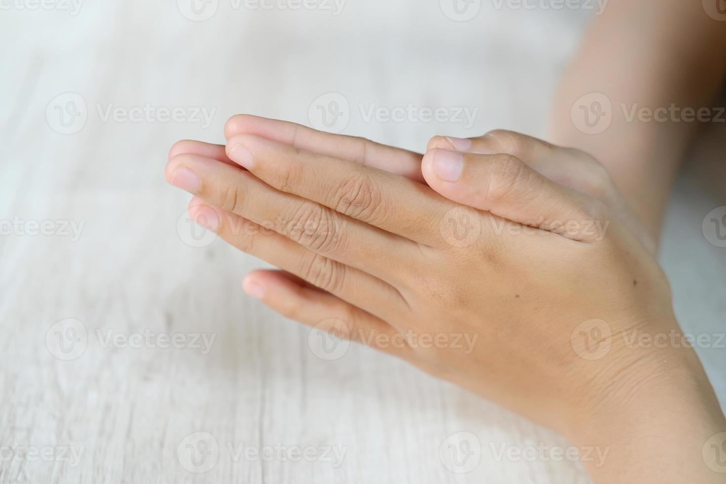 Asian woman's hand gestures are isolated over white background photo