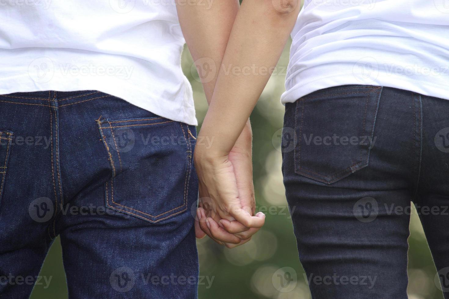 Young couple holding hands photo