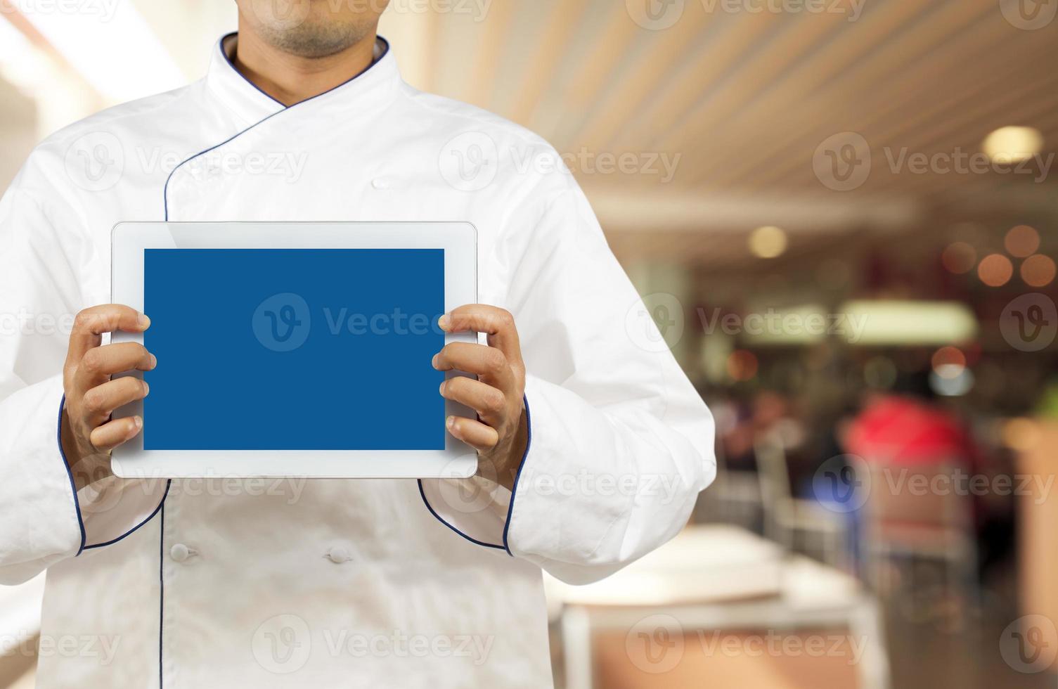 Chef showing a digital tablet photo