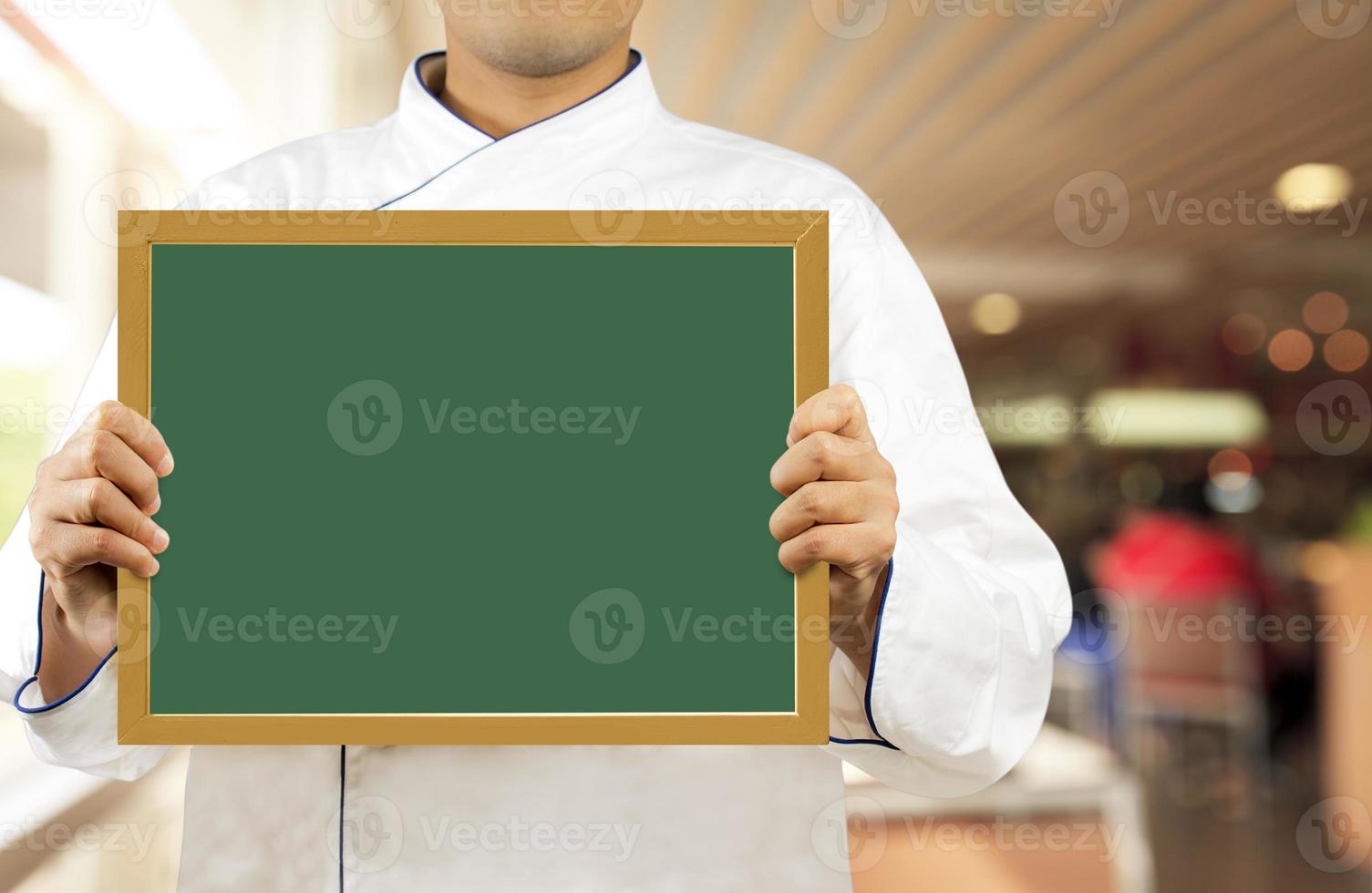 Chef showing chalkboard photo
