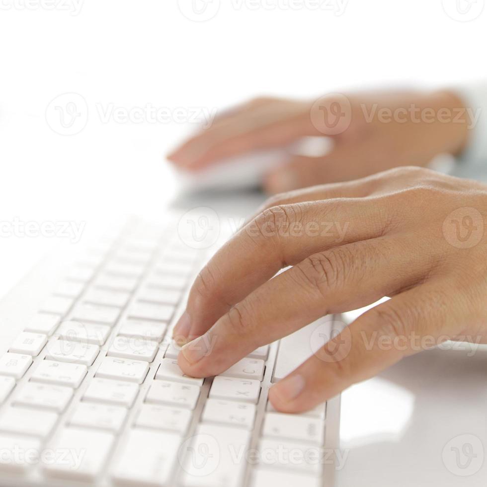 Hand typing computer keyboard photo