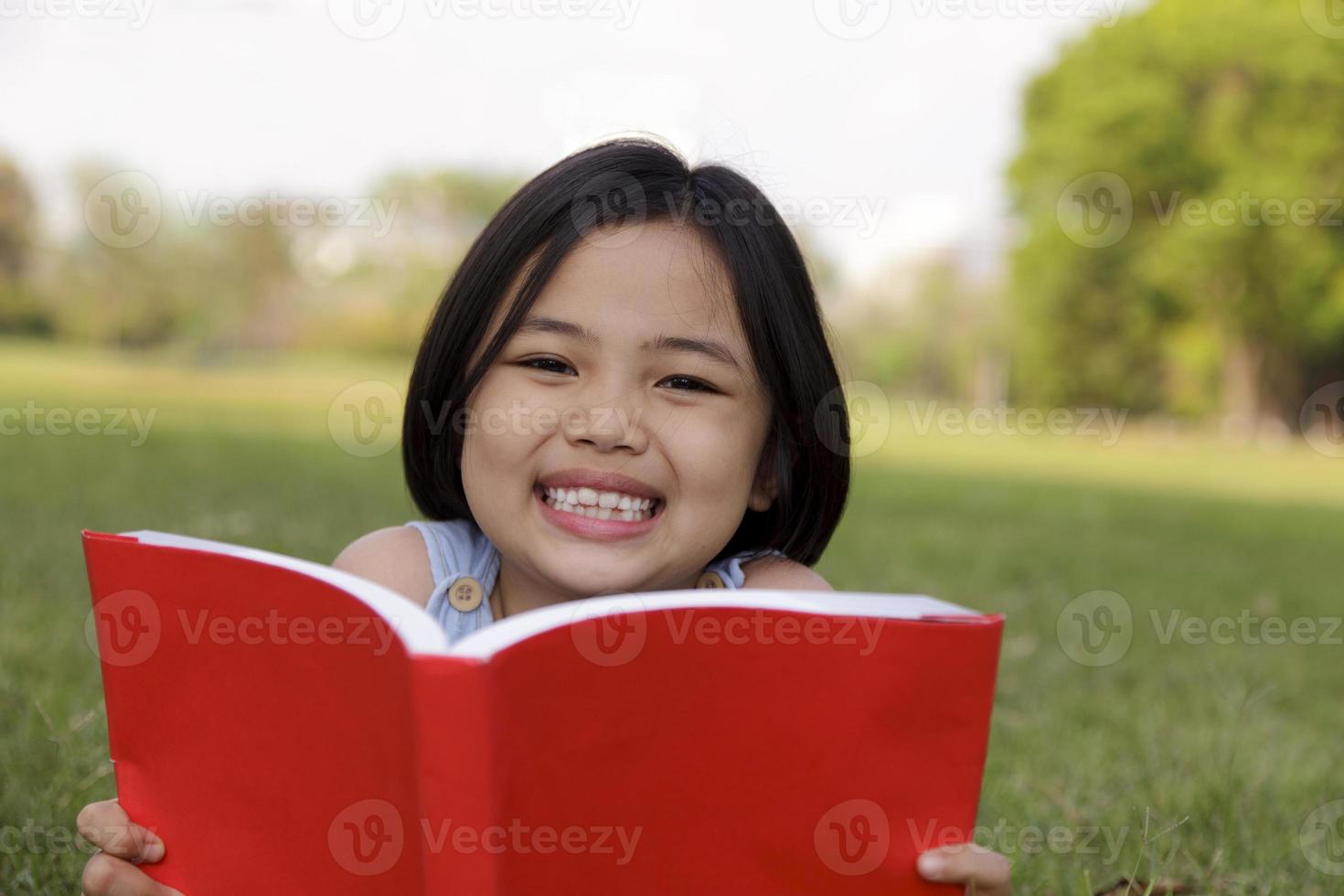 Asian girl reading book photo