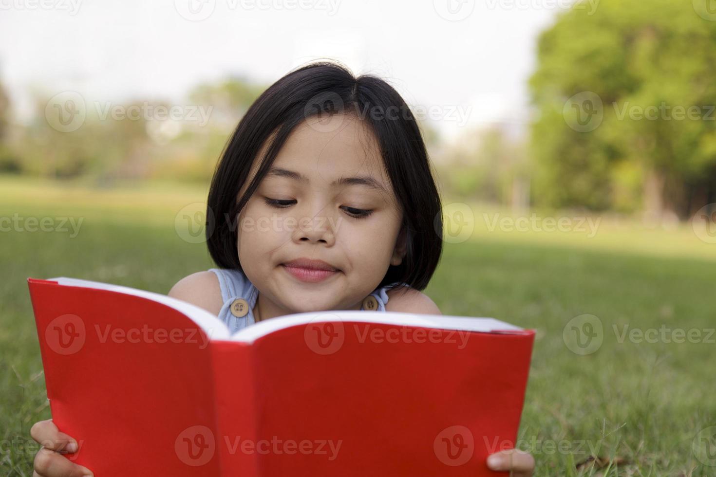 Asian girl reading book photo