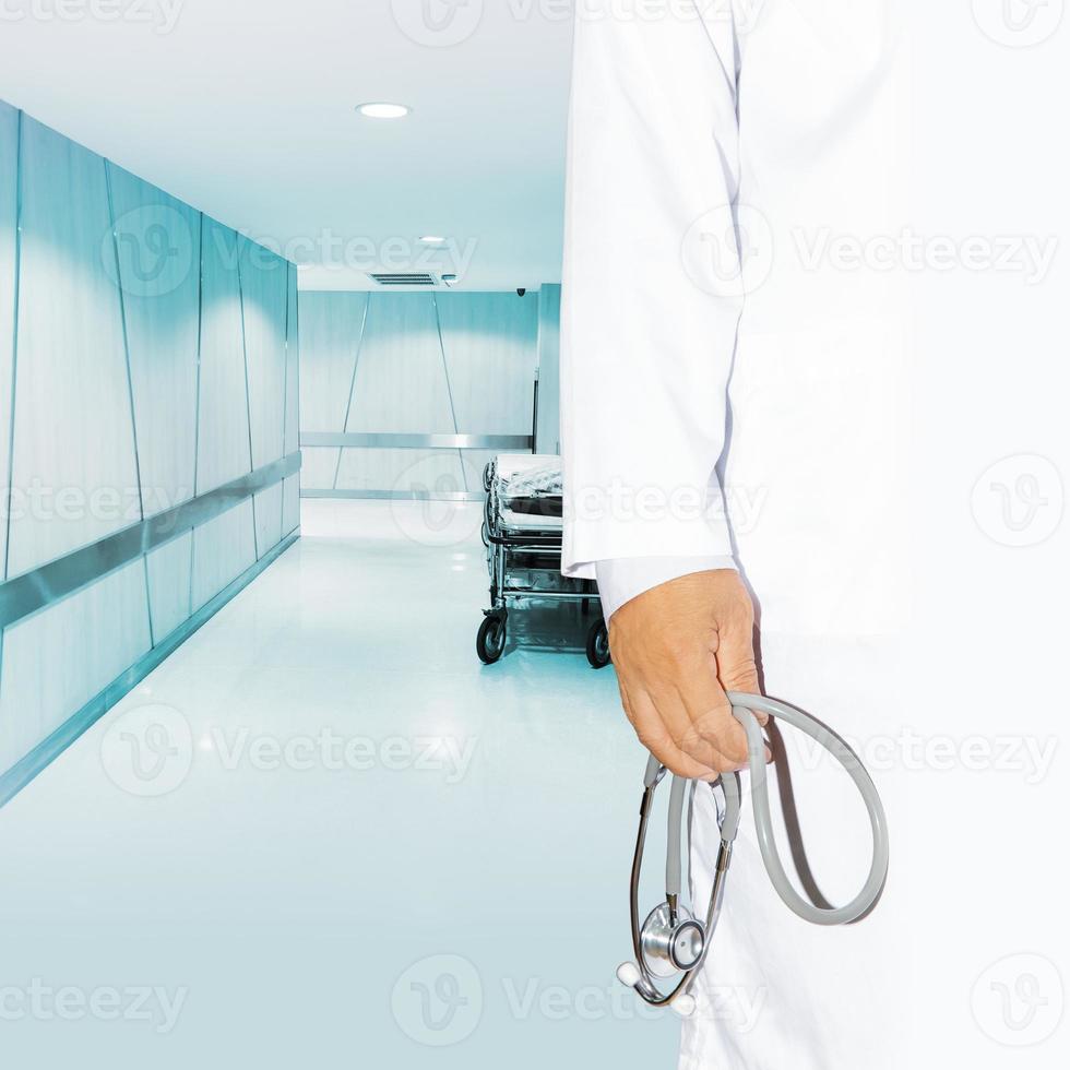 Doctor holding stethoscope photo
