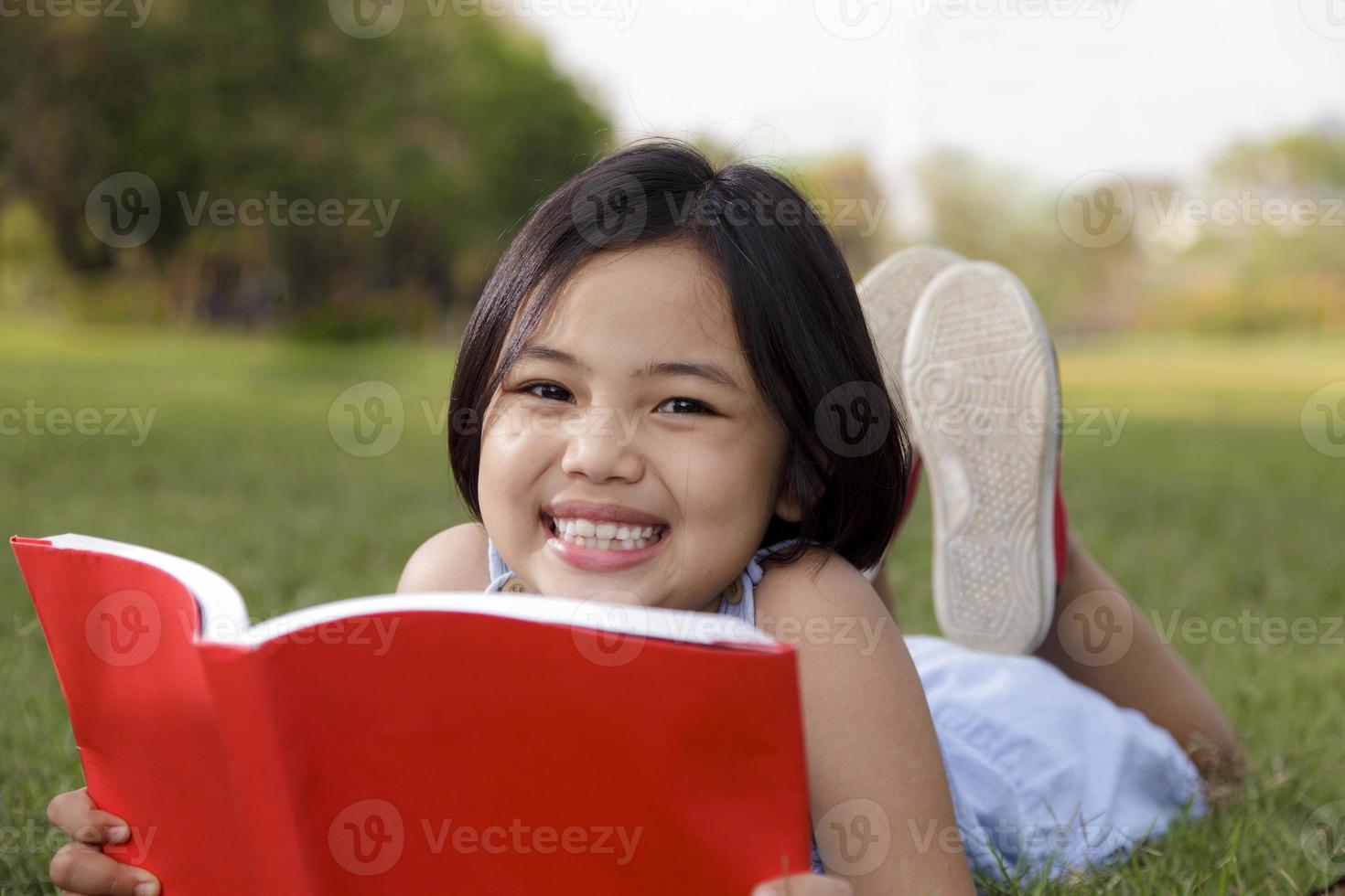 Asian girl reading book photo