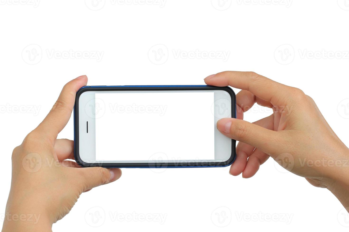 Taking photo with mobile phone on white background, Hand holding mobile smart phone with blank screen.