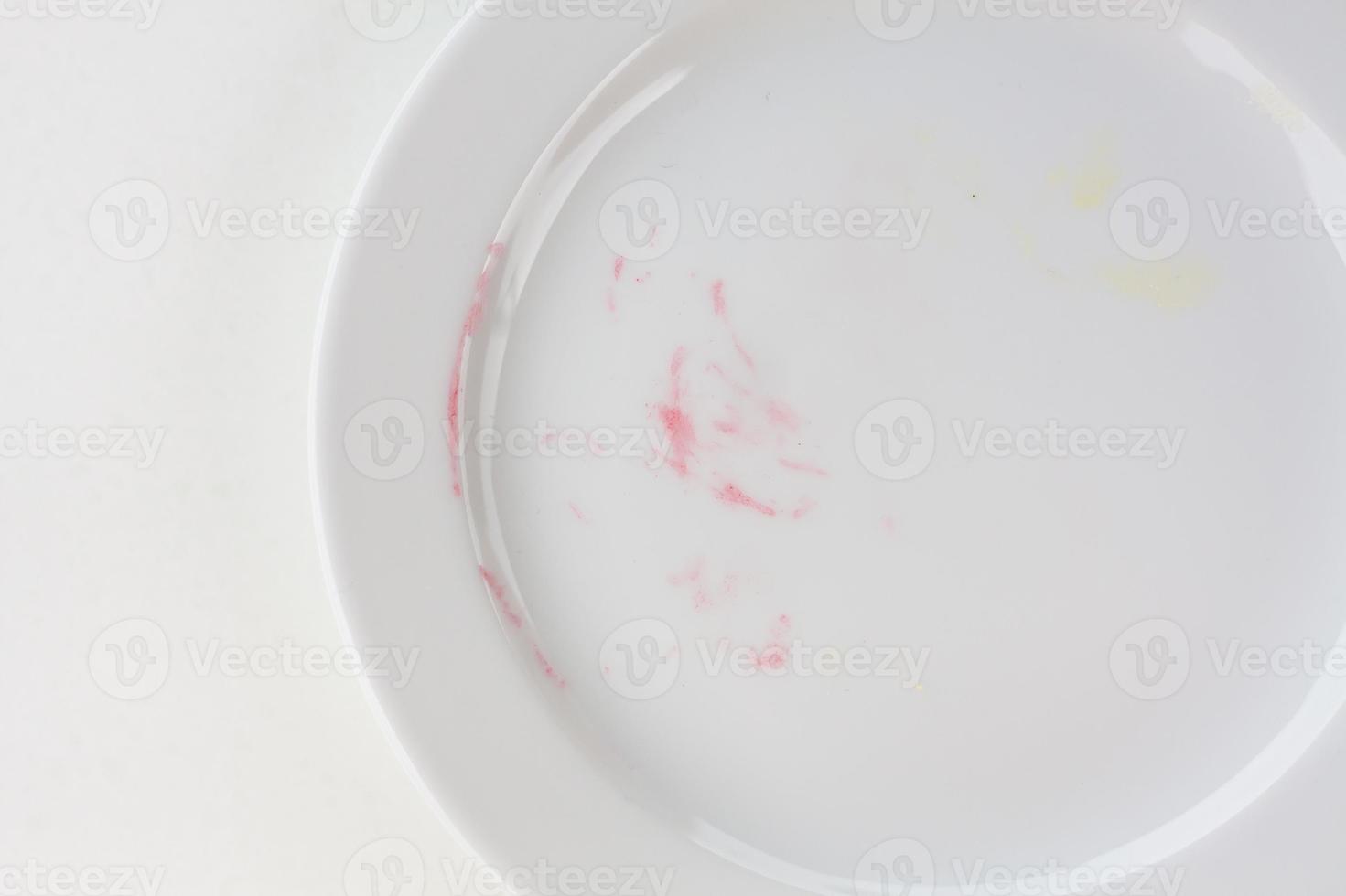 empty plate on white table after blackberry pie photo