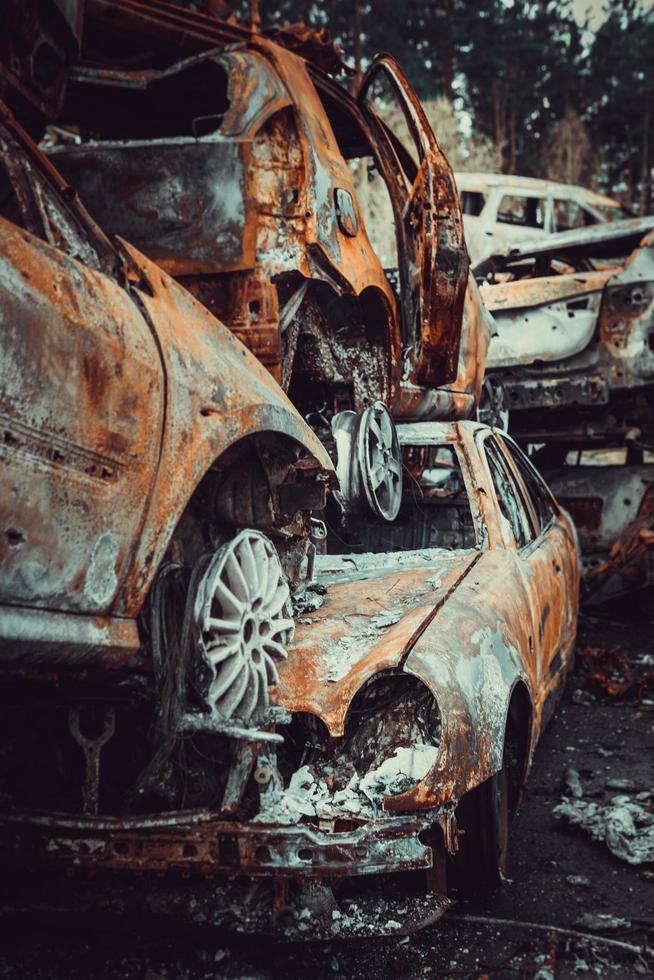 Irpin, Kyiv region, Ukraine - 28 April 2022.  Car graveyard in Irpin, consequences of the invasion of the Russian army in Ukraine. photo