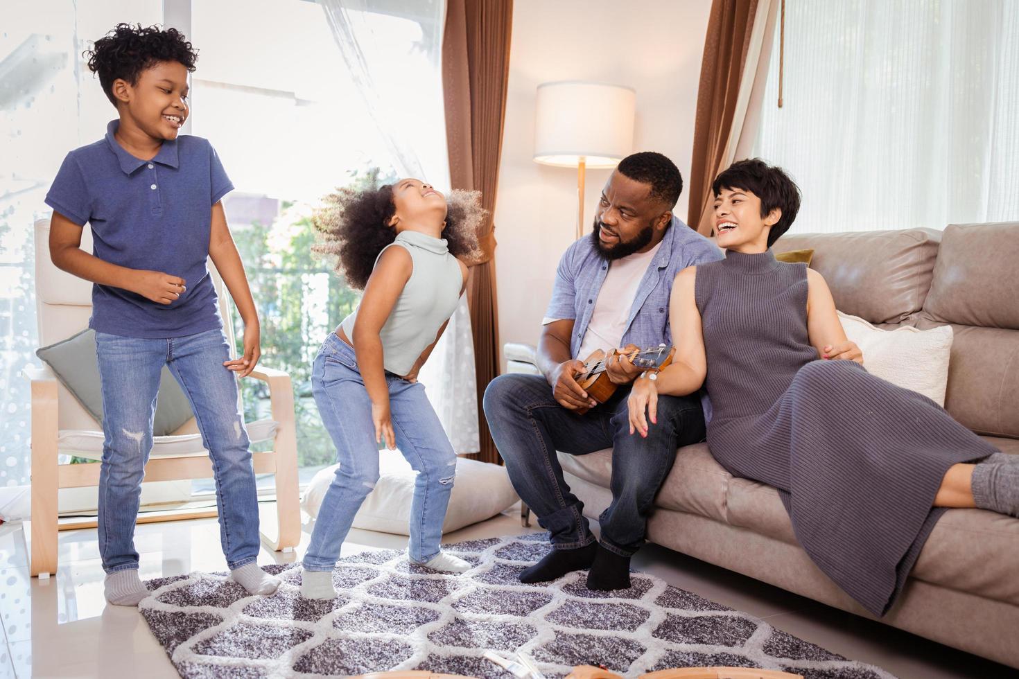 Happy African American family spending time together concept. African American family home activity photo