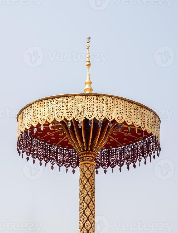 Golden umbrella sculpture. photo