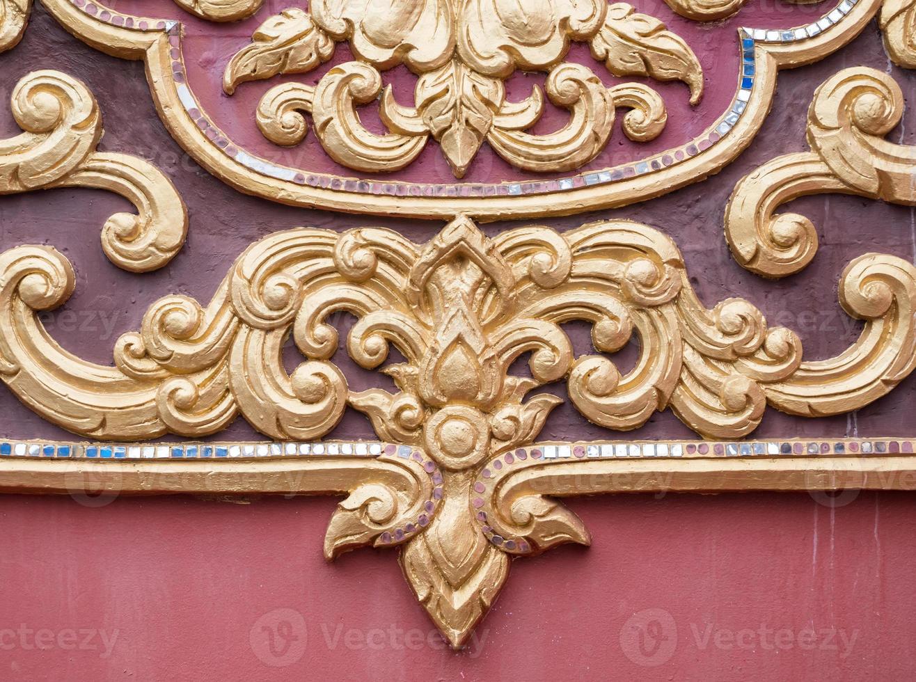 Floral pattern stucco in the traditional Thai style. photo