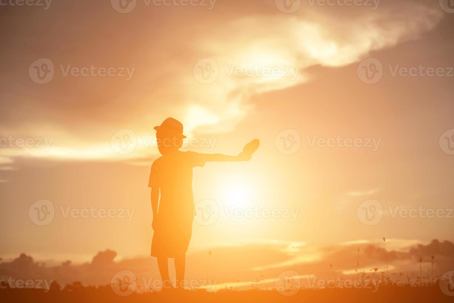 kid silhouette,Moments of the child's joy. On the Nature sunset photo